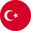 A red circular flag with a white star and crescent design in the center, representing the national flag of Turkey.