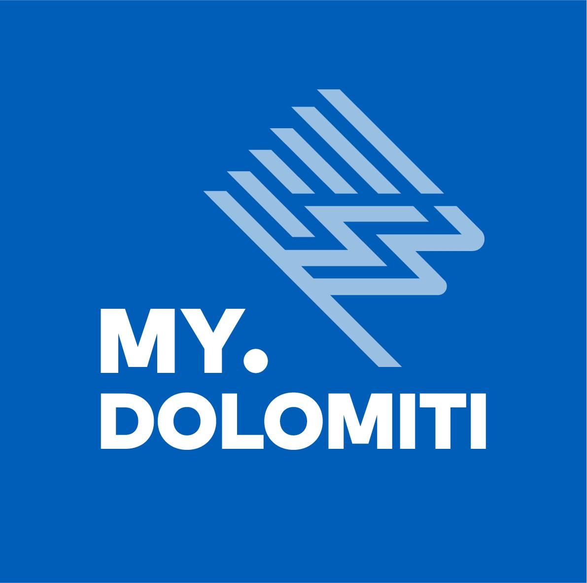 Logo with stylized mountain design in light blue on a blue background. Text reads "MY. DOLOMITI.