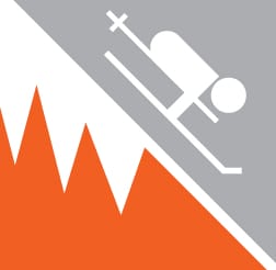 Icon depicting a person skiing downhill on a steep, jagged mountain slope. The left side is orange with white peaks, and the right side is gray with a stylized skier.