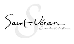 Logo with stylized script text reading "Saint-Véran" and smaller text below that reads "Les couleurs du blanc," all in black on a white background.