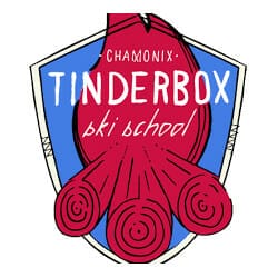 Logo for Tinderbox Ski School Chamonix, featuring a blue shield with a stylized red campfire and white text.