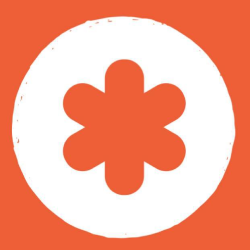 A white circle on an orange background containing an orange asterisk-like shape in the center.